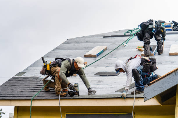 Professional Gutter Installation technician working in Bellaire, MI